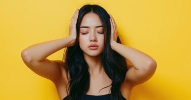 Woman covering her ears