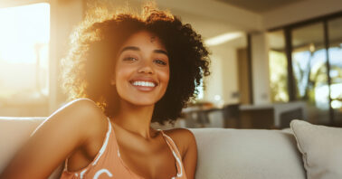 Woman sitting on a couch looking relaxed