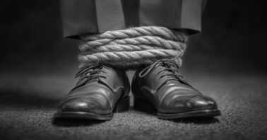 Ankles bound by rope