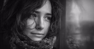 Woman looking out of a window