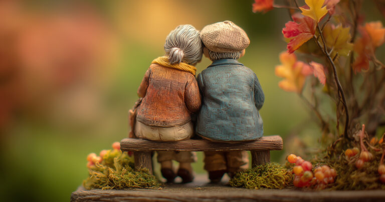 Figurine couple sitting on a bench