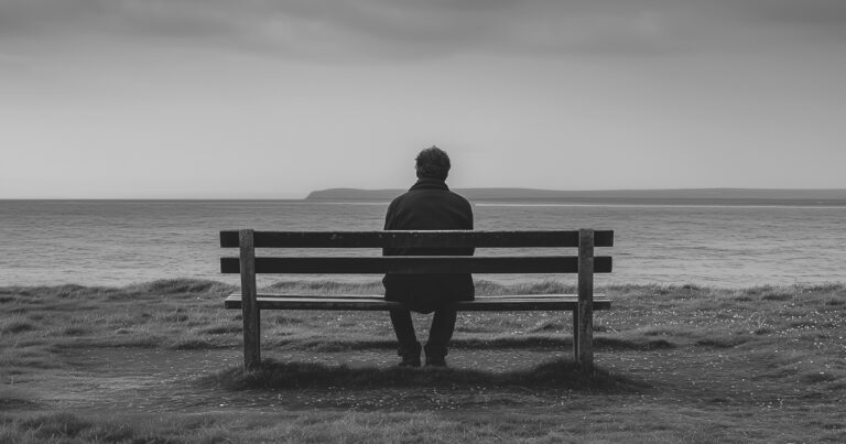 Man sitting alone on a bench