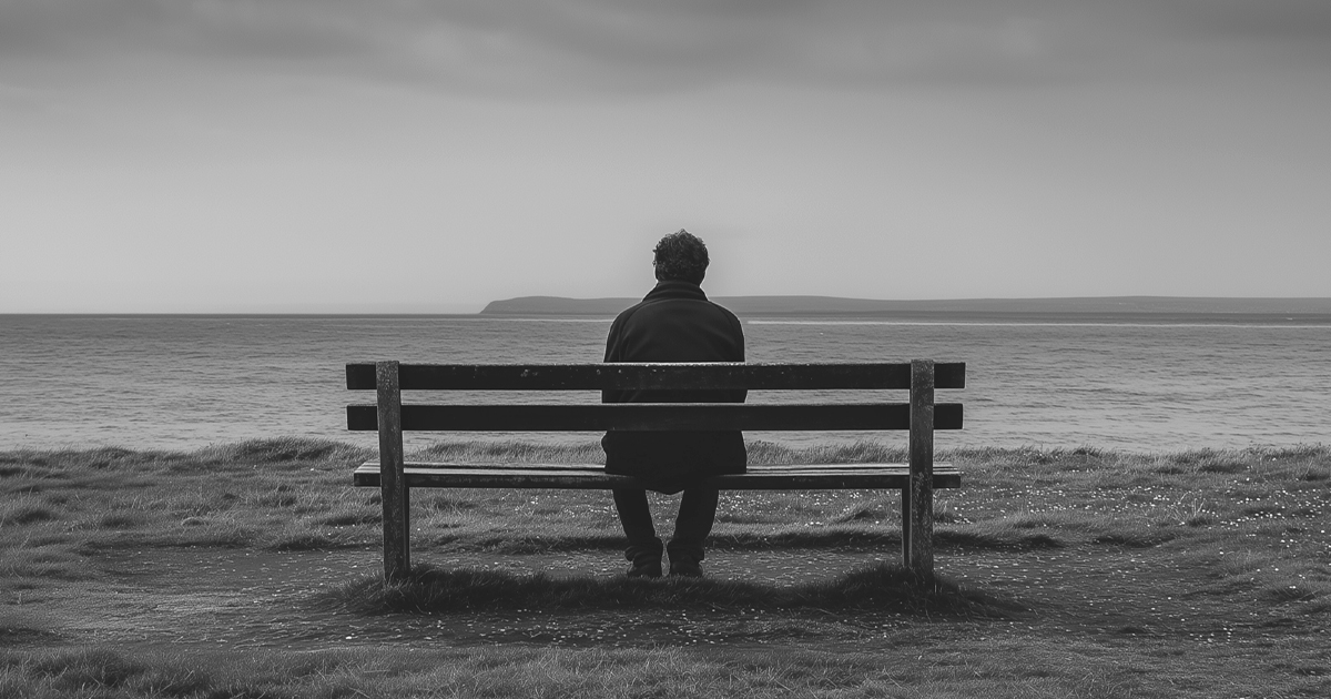Man sitting alone on a bench