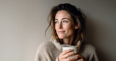 Woman holding a mug looking relaxed