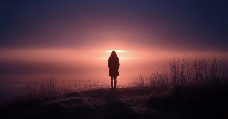 Silhouette of a person at sunrise
